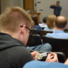 A student examines the FilmArray panel at Kirk Ririe's talk